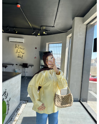 قميص اصفر زبدة - بتخصّر بربطات صغيرة قميص اصفر زبدة - بتخصّر بربطات صغيرة