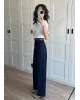 High-Waisted Dark Blue Ribbed Jeans with Tan Belt