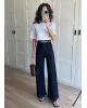 High-Waisted Dark Blue Ribbed Jeans with Tan Belt