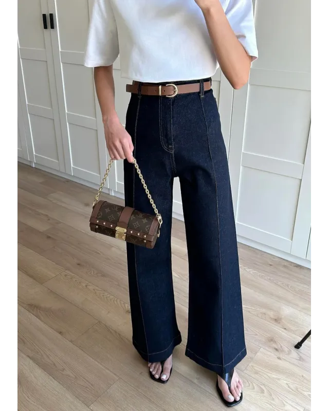 High-Waisted Dark Blue Ribbed Jeans with Tan Belt
