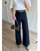 High-Waisted Dark Blue Ribbed Jeans with Tan Belt